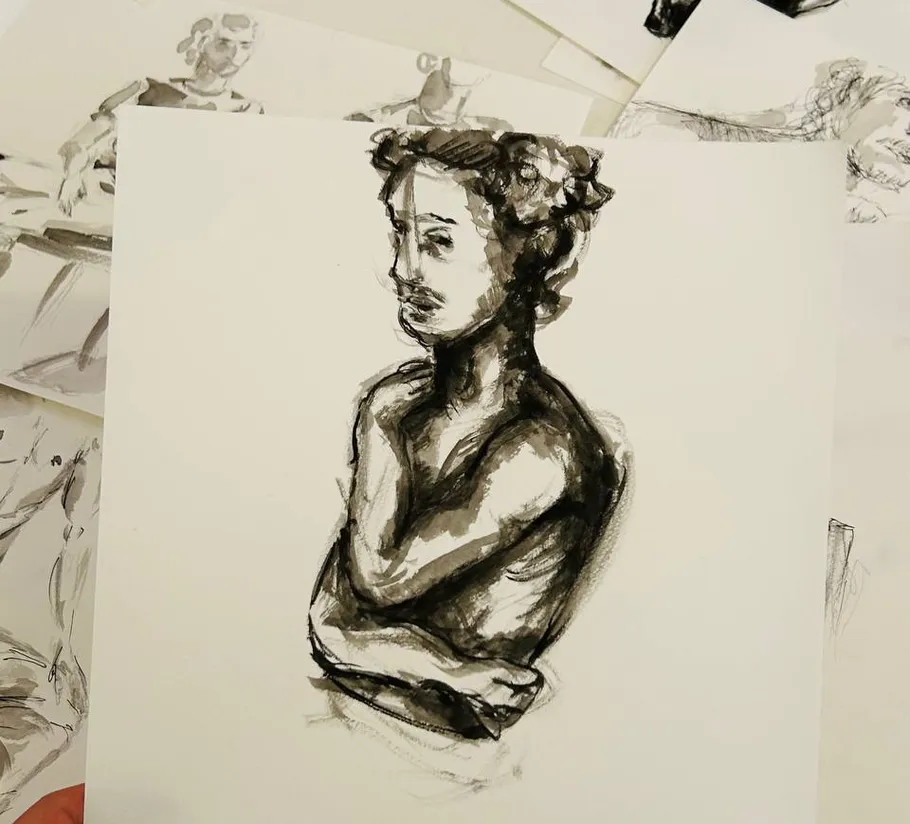 Charcoal drawing of a bust on paper.
