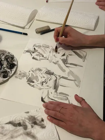 Hand painting a watercolor illustration.