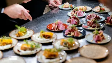 Small plates of gourmet dishes on a table.