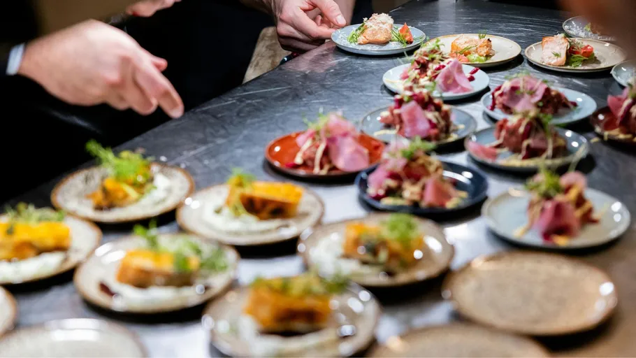 Small plates of gourmet dishes on a table.
