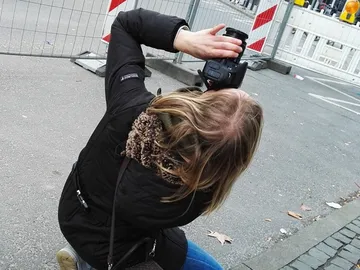 A person takes pictures from a low position.