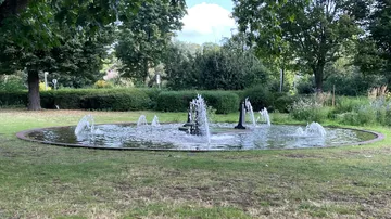 Fountain water jets in a park.