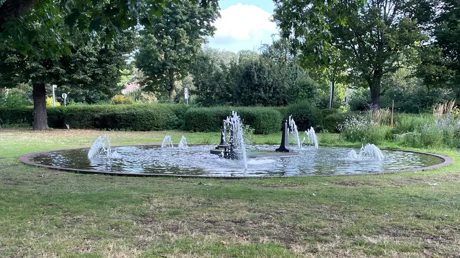 Fountain water jets in a park.