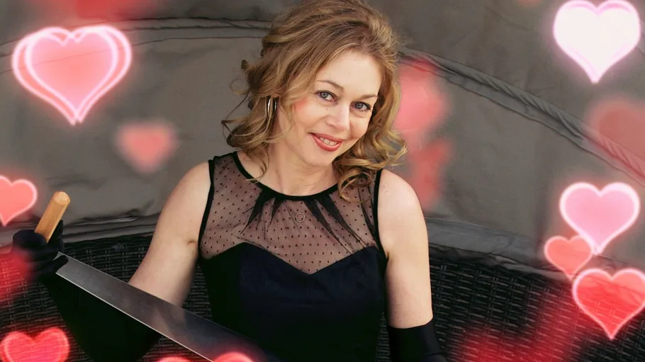 Woman holding machete, surrounded by pink hearts.