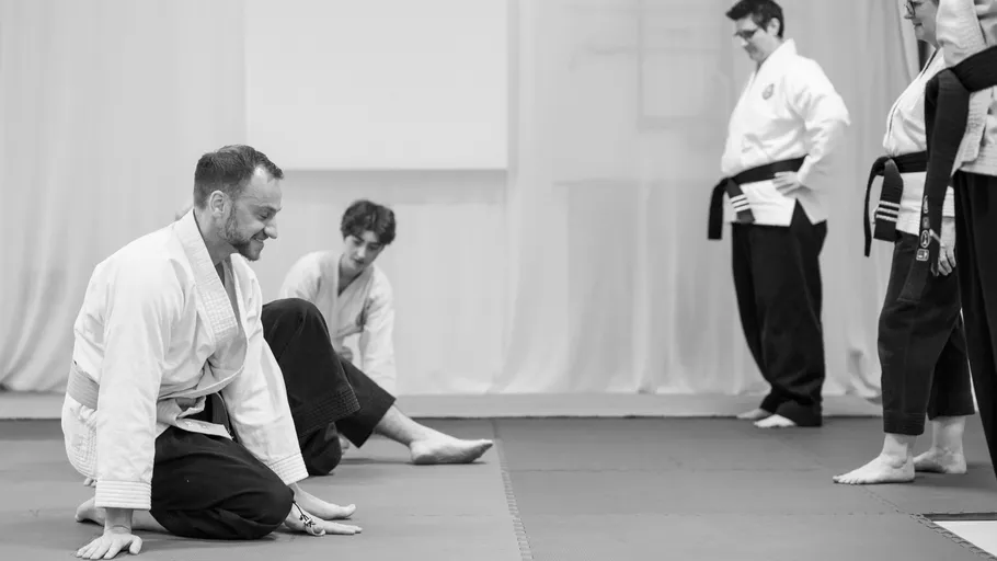 People practicing martial arts in a dojo.