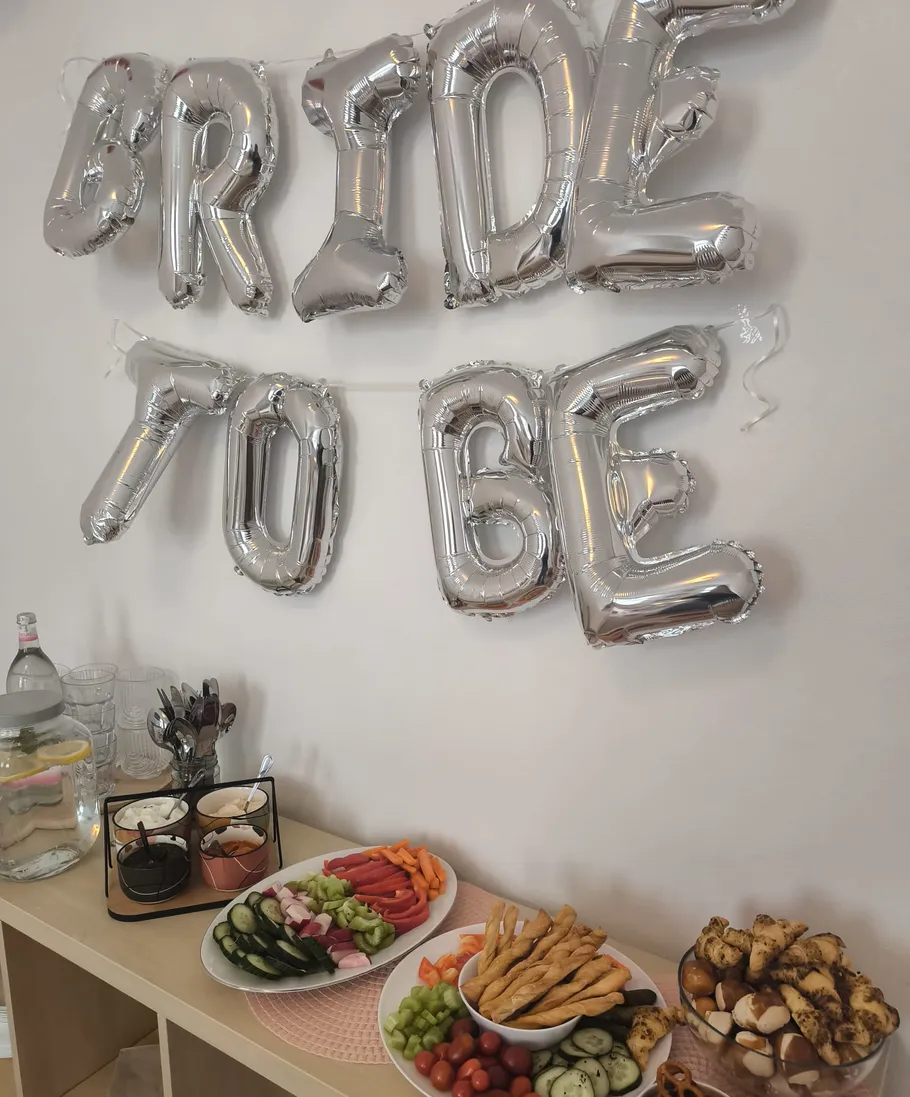 Food table setup for bride-to-be party.