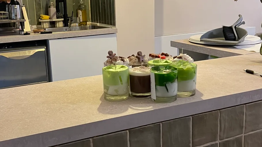 Colorful drinks with decorations on countertop.