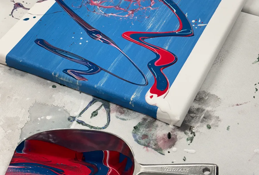 Abstract painting with swirling colors on canvas.