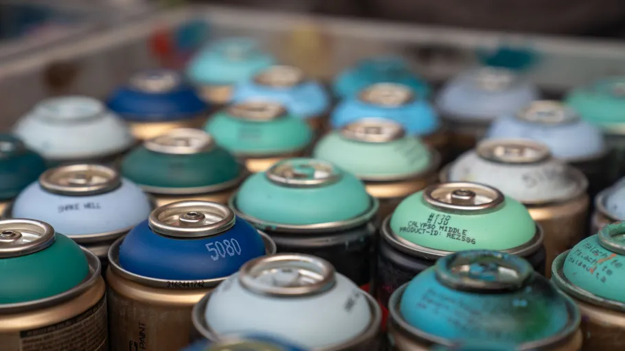 Spray paint cans in various colors.