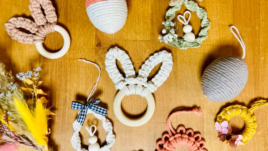 Handmade macrame items on wooden table.
