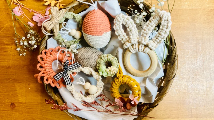 Handmade crochet items in a decorative basket.