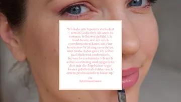 Frau trägt Make-up am Auge auf.