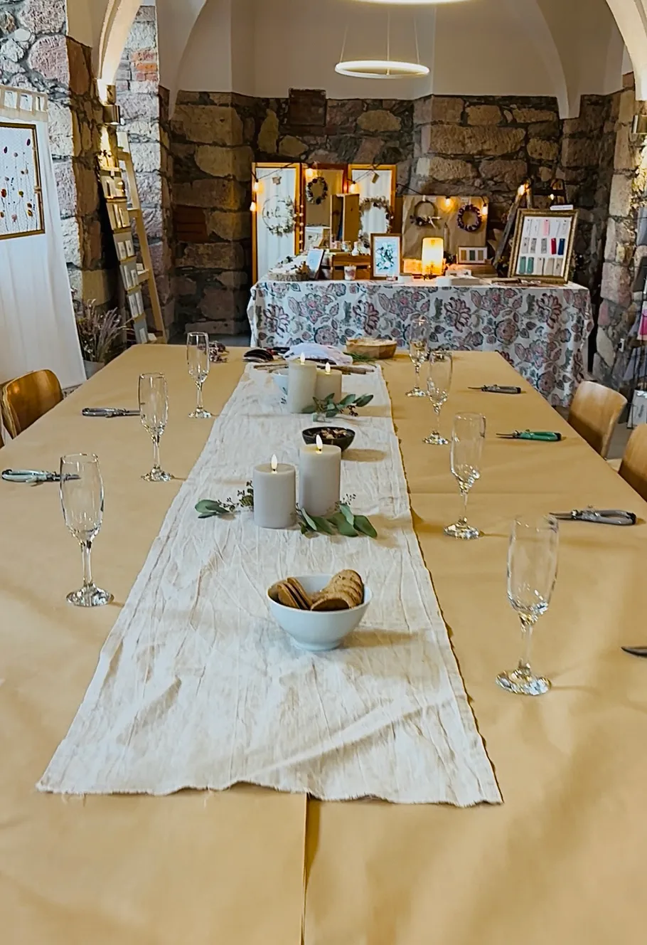 Decorated table with candles and snacks indoors.