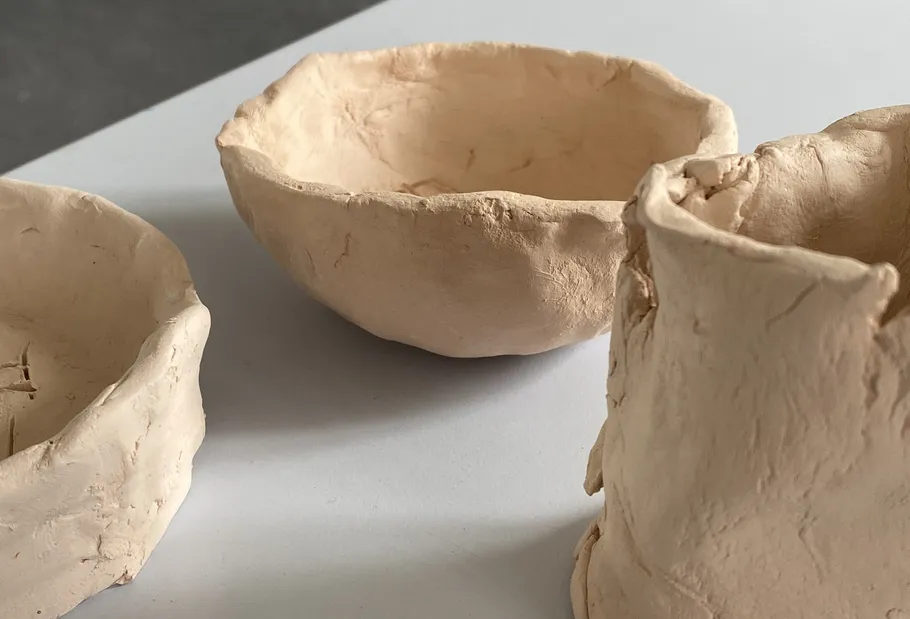 Clay bowls on a white surface.