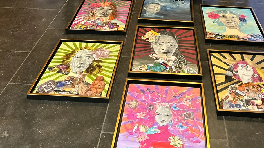 Colorful collage portraits displayed on tiled floor.