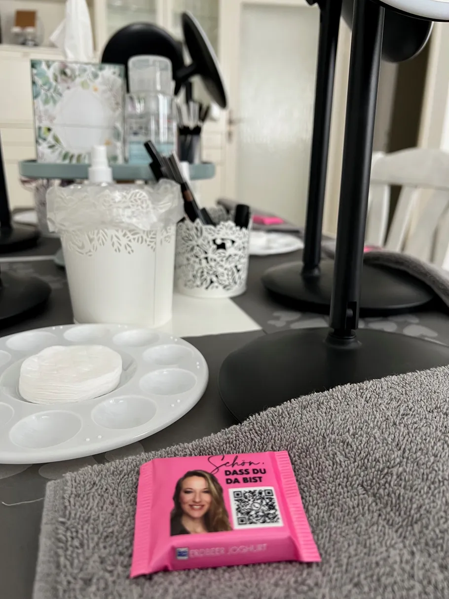 Cosmetics and towel on a table.