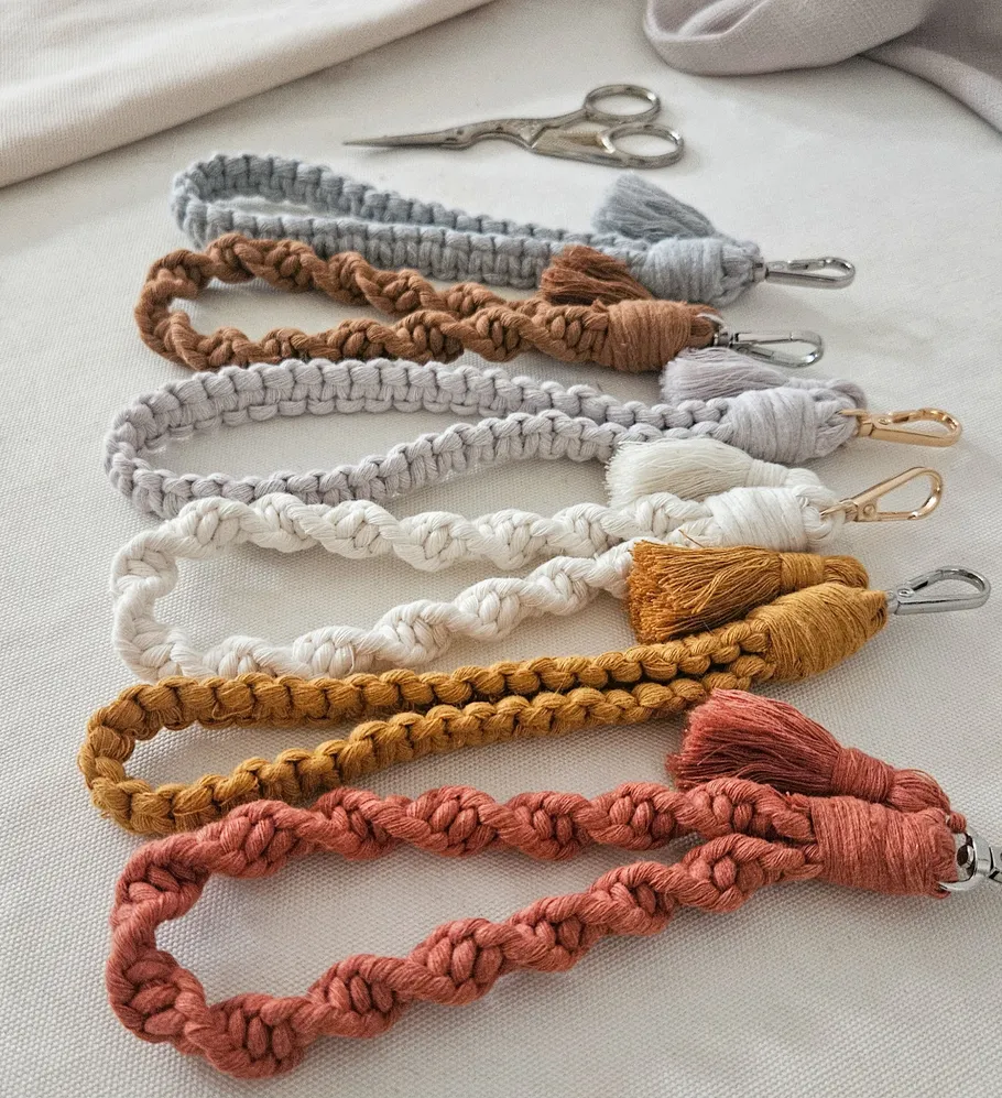Colorful braided keychains on a table.