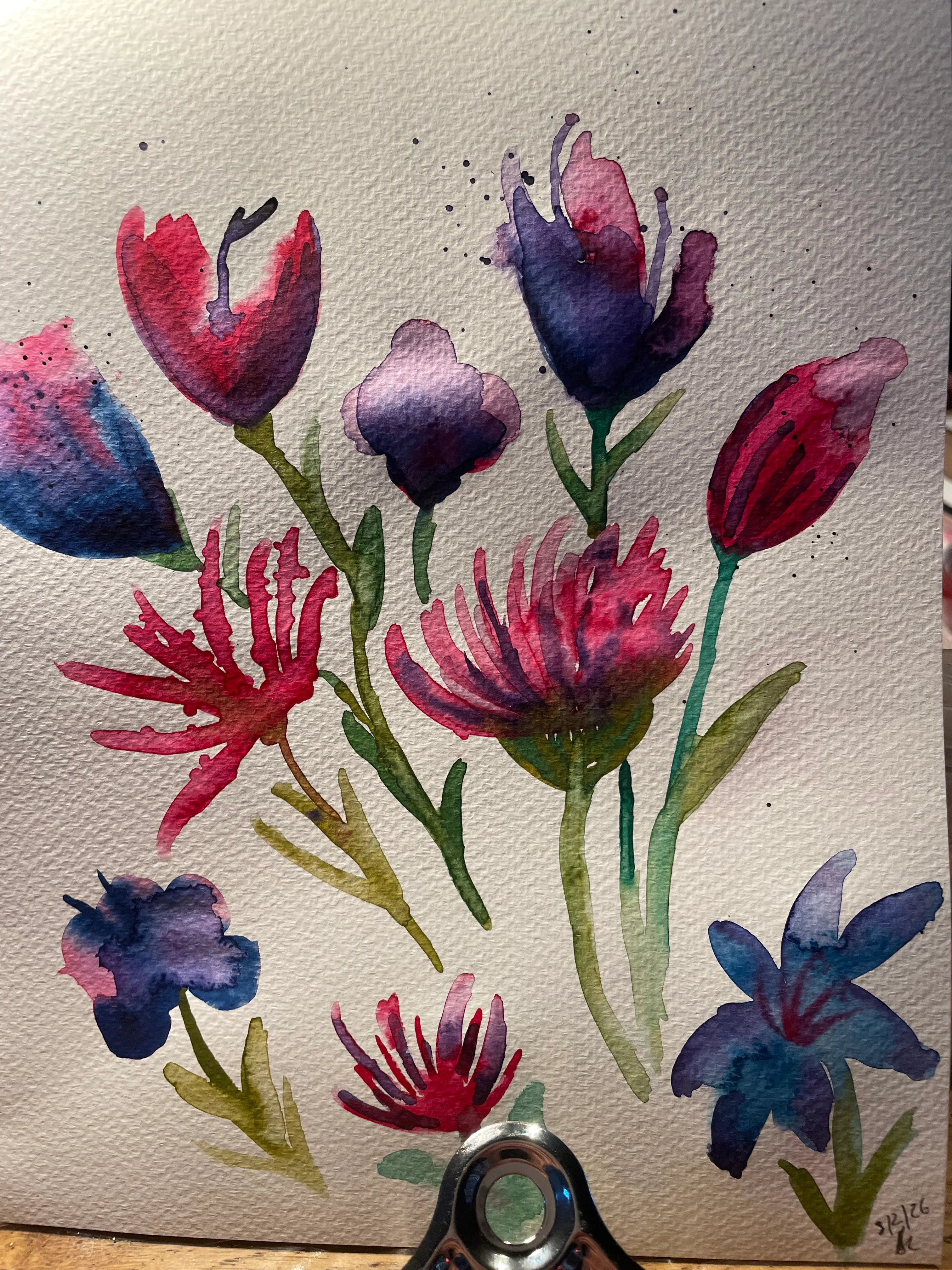 Watercolor flowers in shades of pink and purple.