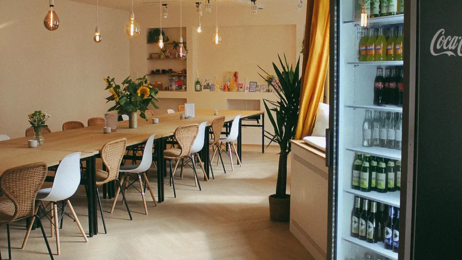 Modern dining area with a beverage fridge.