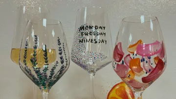 Decorated wine glasses with colorful patterns.