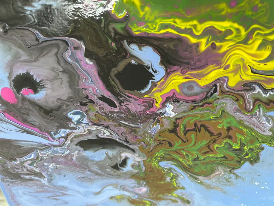 Colourful swirls of color move harmoniously across a surface.