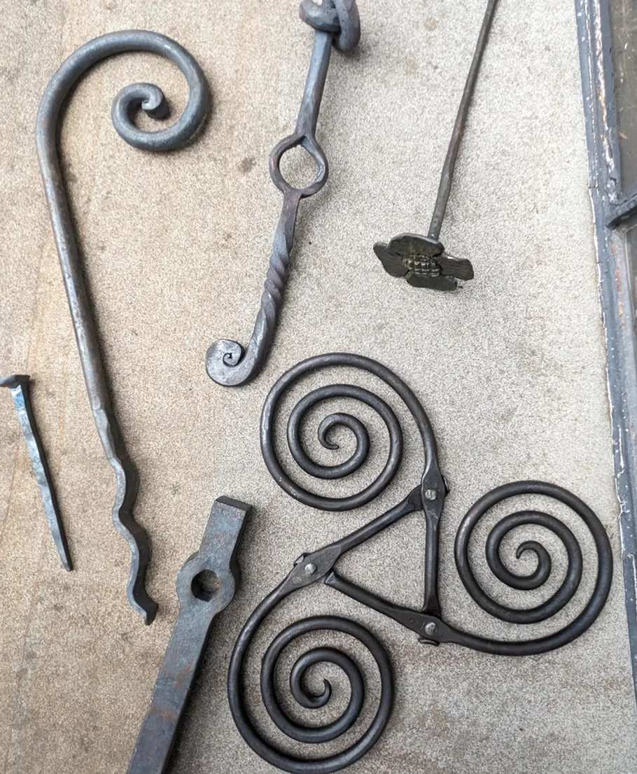 Metal spiral designs on a flat surface.