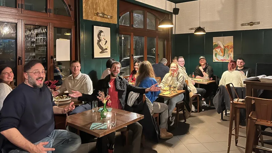 Group laughing at a restaurant table.