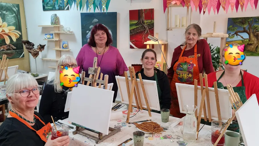 Group of women painting in art studio.