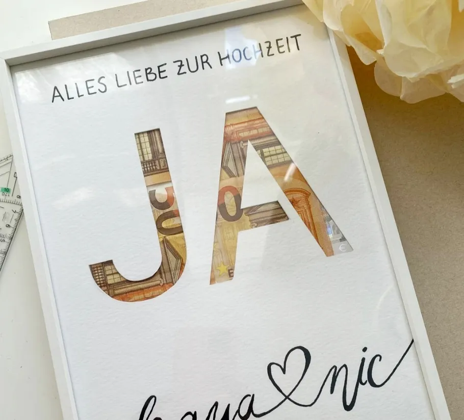 Gerahmtes Hochzeitsgeschenk mit Geld.