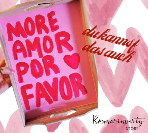 Hand holds tray with pink text.