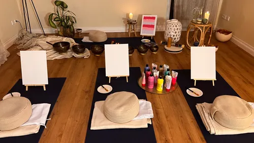 Painting setup with cushions in cozy room.