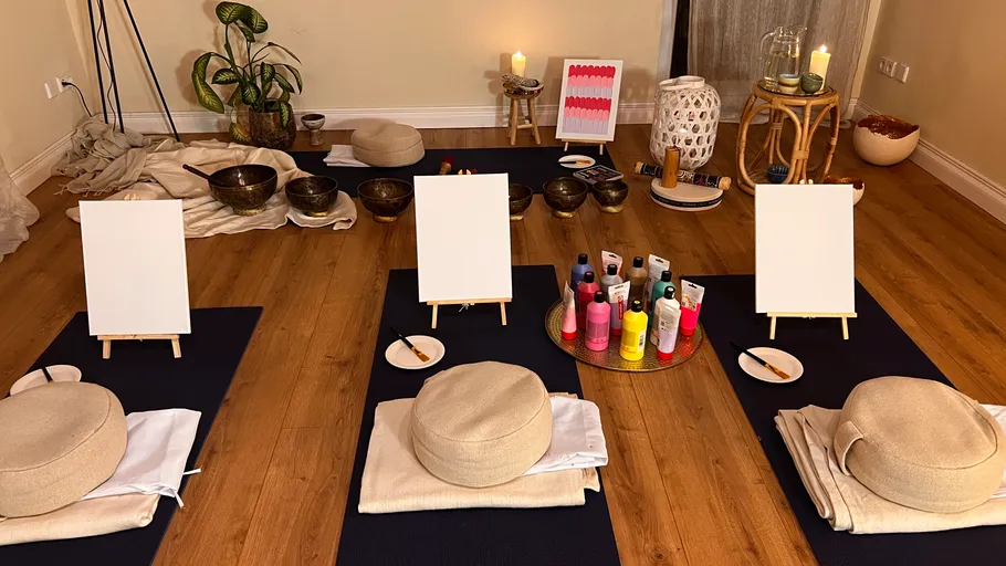 Painting setup with cushions in cozy room.