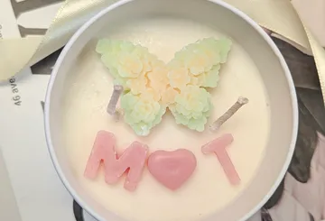 Candle with butterfly and M heart T design.