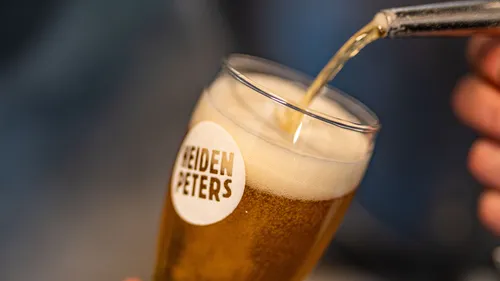 Beer being poured into a glass.