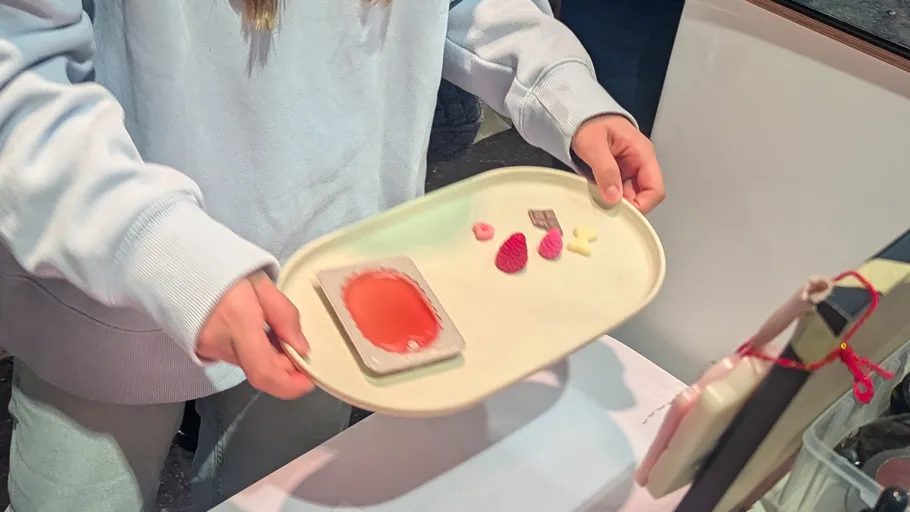 Person holds tray with food items.
