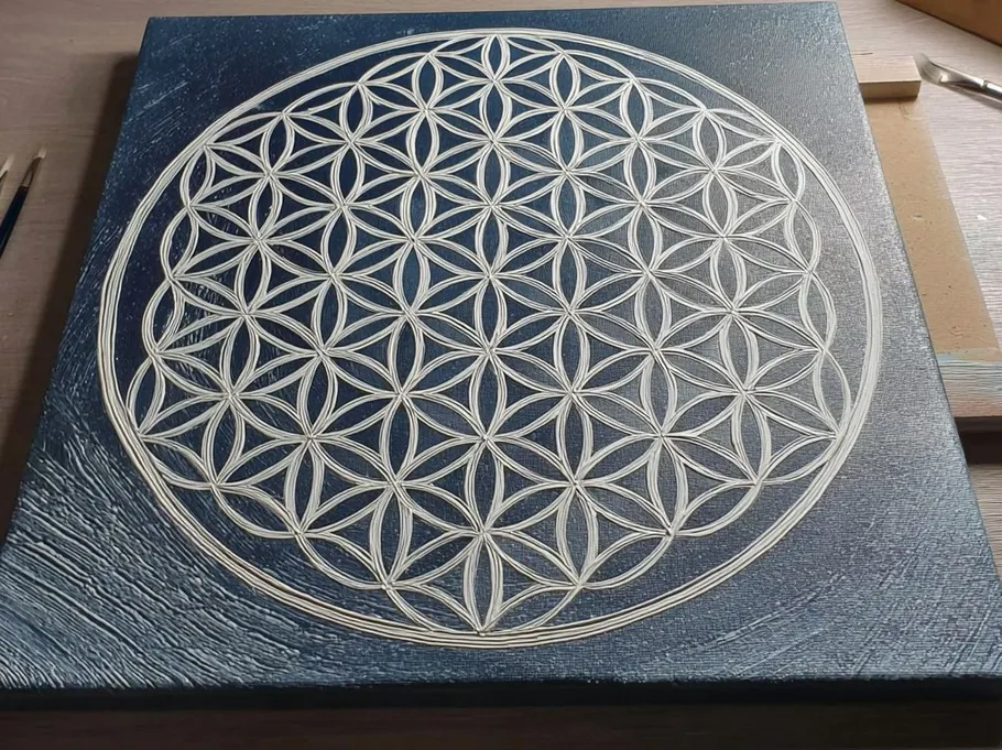 Intricate geometric pattern on canvas, tabletop.