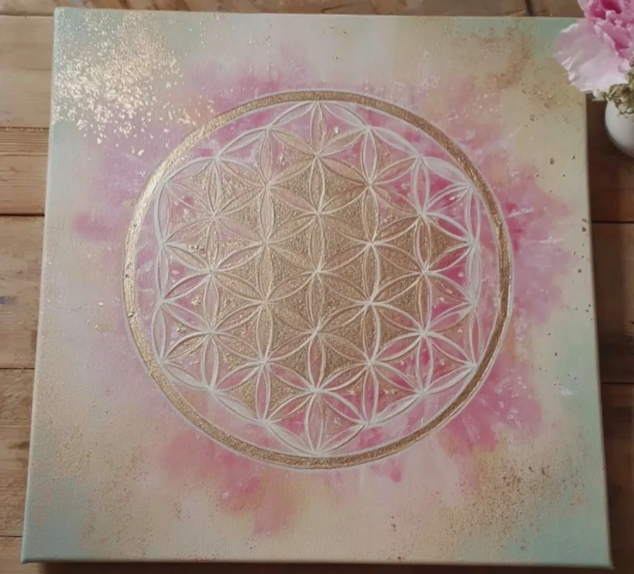 Flower of Life design on colorful canvas.