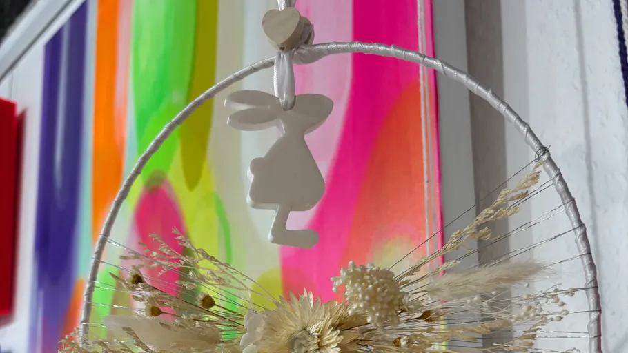 White bunny decor over colorful background.