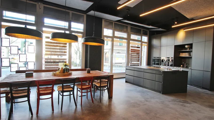 Modern kitchen with large table and island.