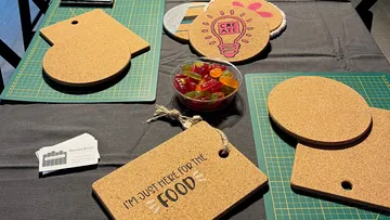 Cork boards and candy bowl on table.