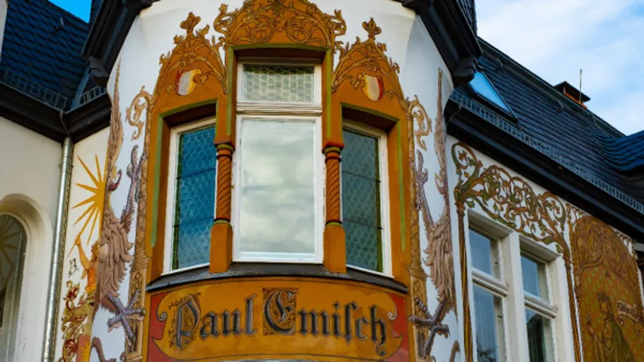 Decorative building facade with ornate designs.