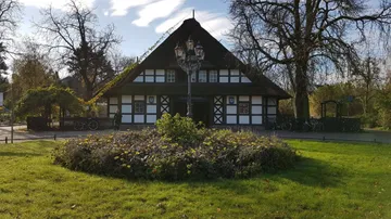 Historic house with garden in autumn.