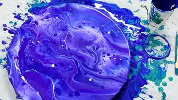 Circular canvas with abstract purple swirl design.