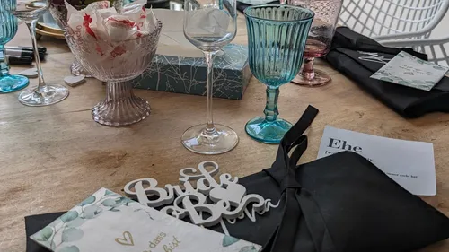 Wedding table with decorations and glassware.