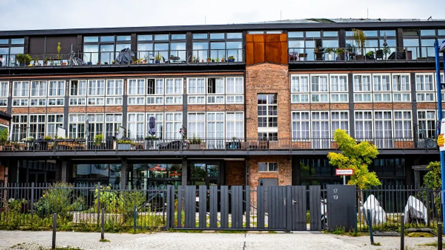 Modern apartment building with large windows.
