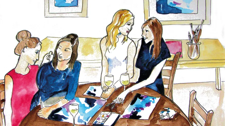 Vier Frauen malen und plaudern am Tisch.