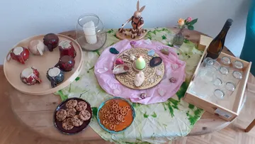 Decorative table with snacks and candles arranged.
