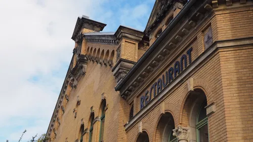 Historic brick building with restaurant sign.