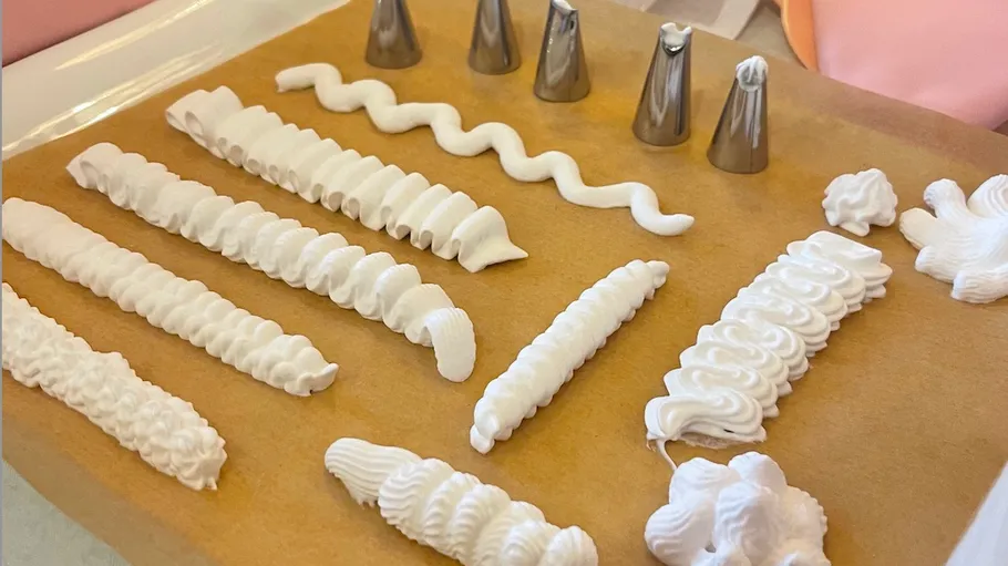 Icing patterns on board with piping tips.