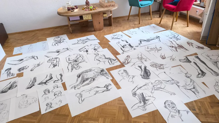 Sketches of figures on floor in living room.